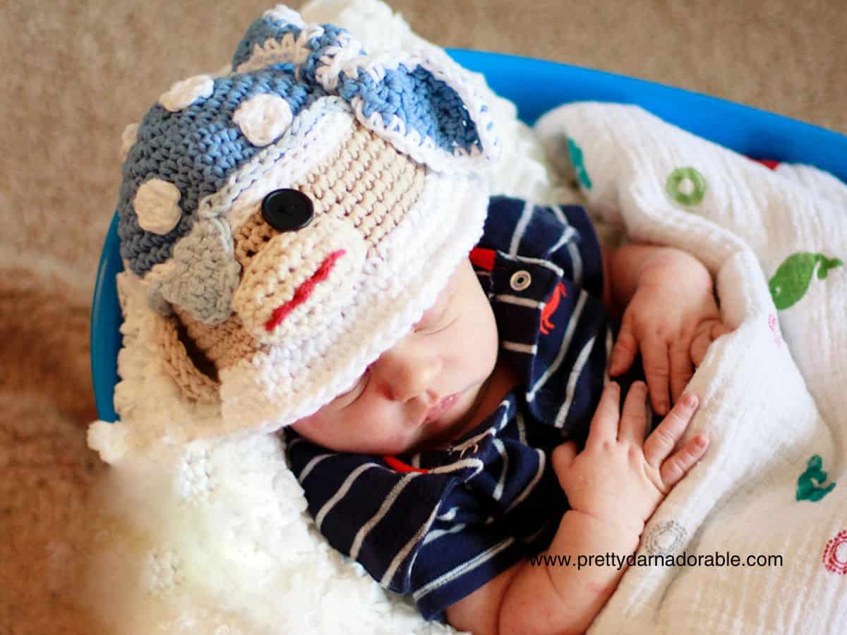 crochet bucket hat that looks like a pirate sock monkey made from red white and blue the monkey has an eye patch too. Free crochet bucket hat pattern.