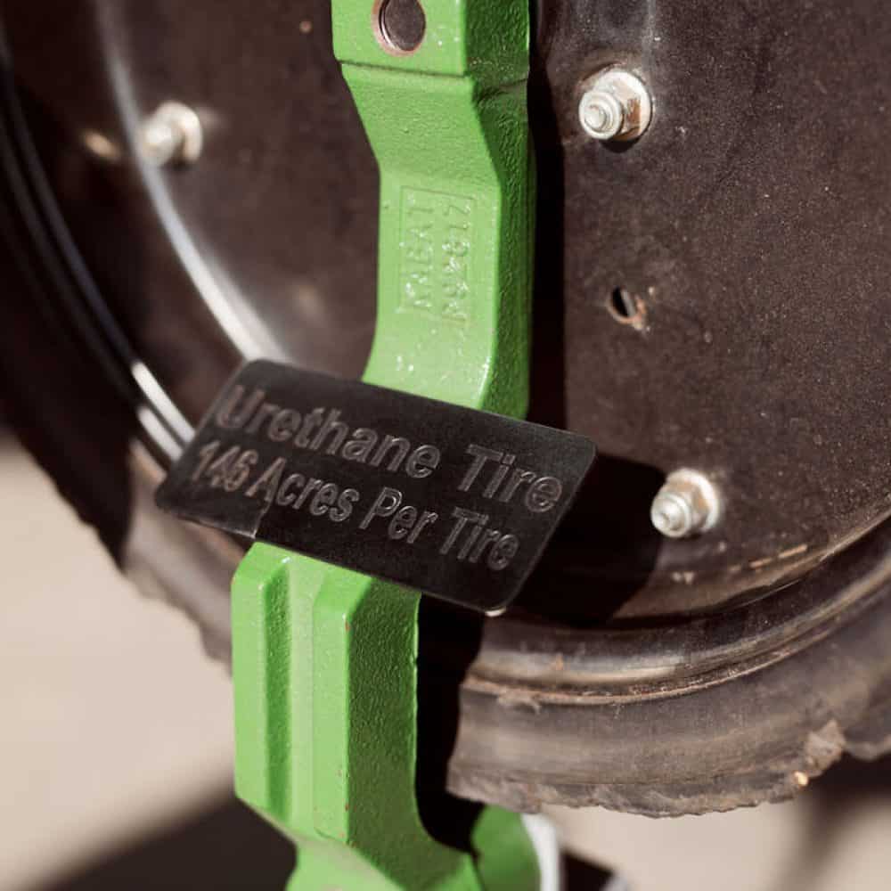 Close-up of a urethane tire showing signs of wear, cracks, and deterioration after prolonged use, highlighting reduced durability.