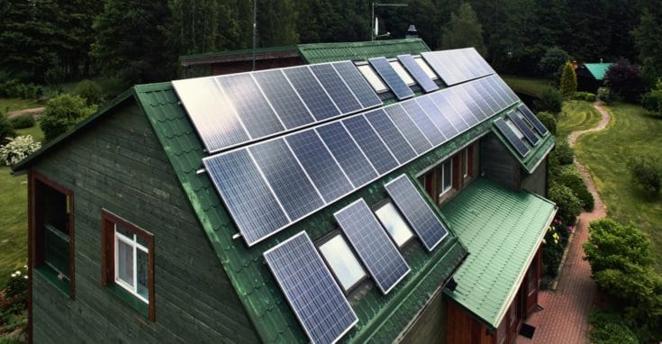 Rustic wooden house with a solar panels on a roof