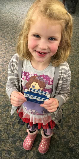 Gracie with her first Library CArd