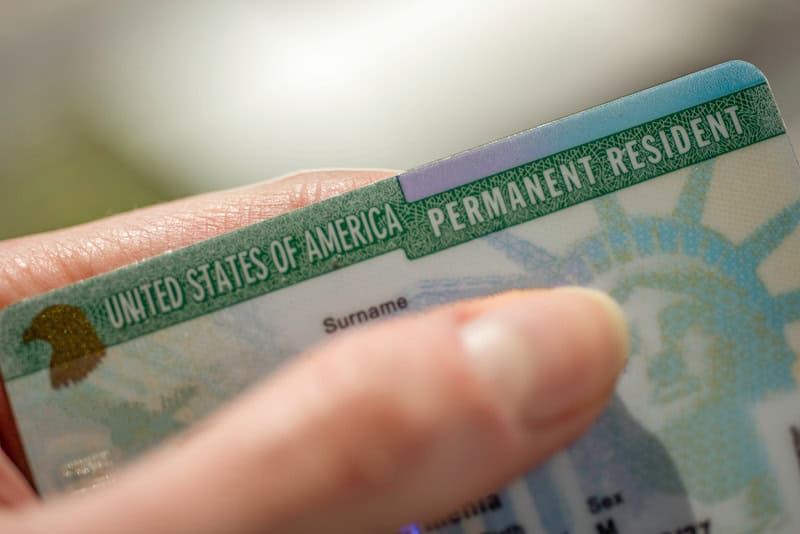 close-up of U.S. permanent resident card for USCIS biometric request article