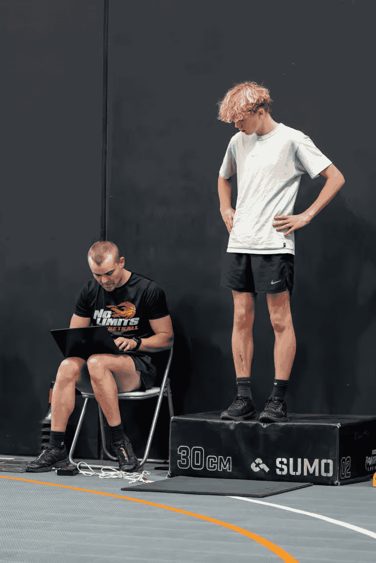 Young basketball player standing on a platform during training at No Limits Basketball, Perth, WA.