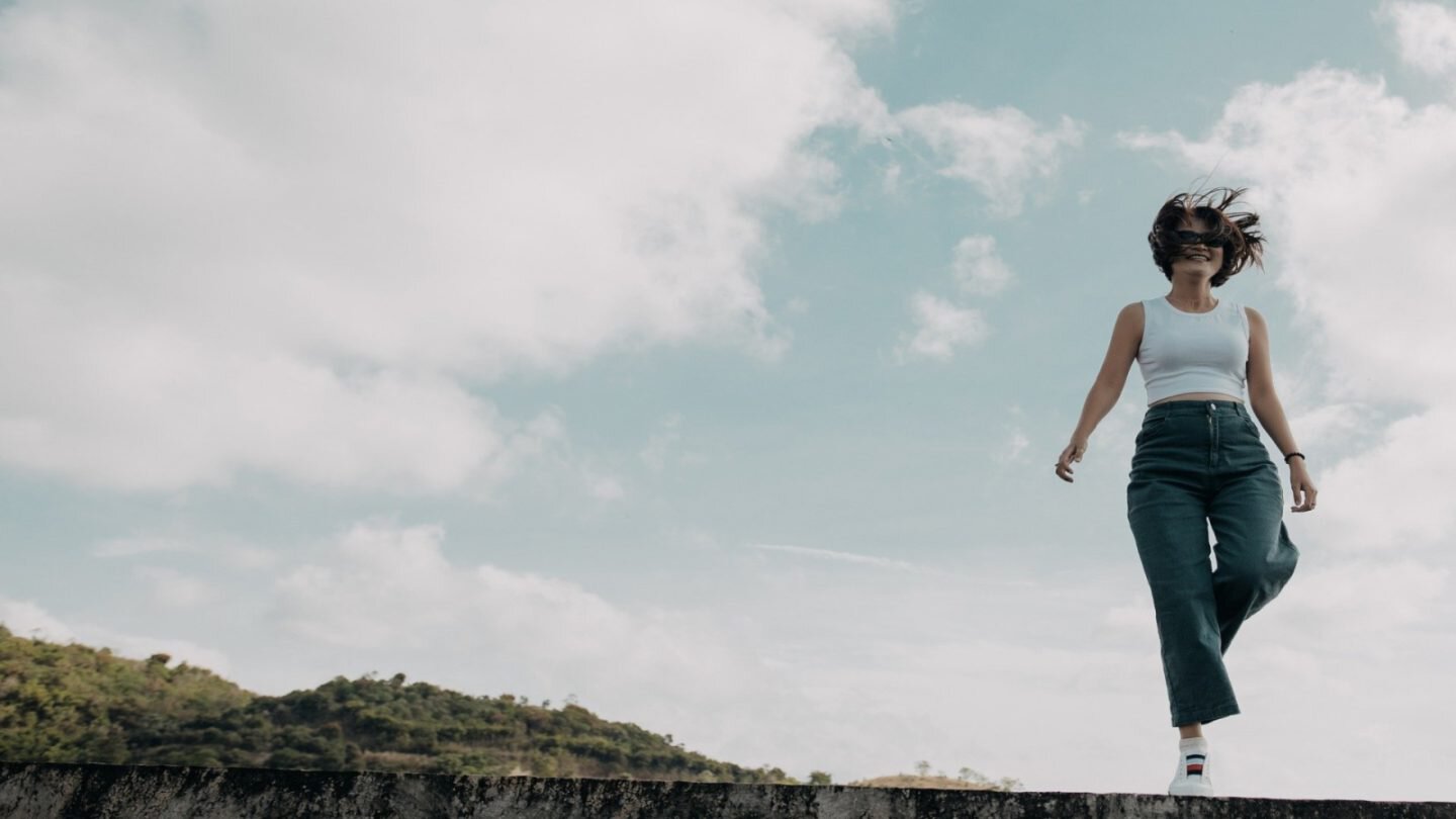 This image has an empty alt attribute; its file name is woman-1-1440x810.jpg