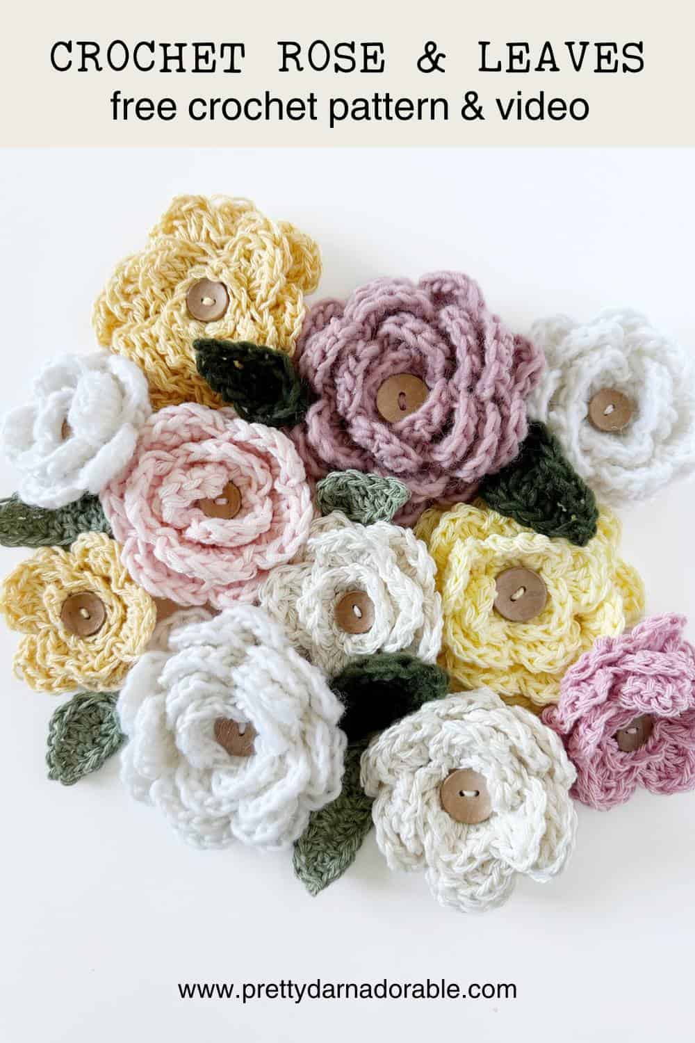 crochet roses in different colours with crochet leaves and buttons