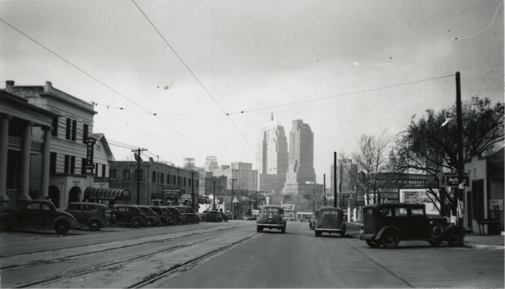 Historic street view of Oklahoma City’s Flatiron District with vintage cars