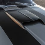 A laptop computer sitting on top of a car