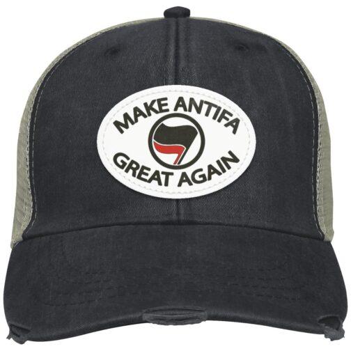 Distressed black trucker cap with a vegan leather patch reading "Make Antifa Great Again" around an Antifa flag symbol. Anti-fascist apparel detail.