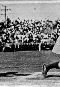 AAGPBL batter and catcher ph 7424794 Female baseball catcher reaching for ball during game, vintage black and white photo.