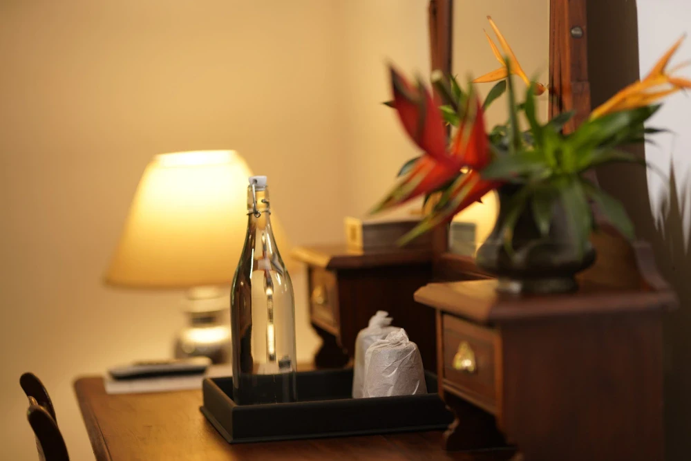 A vintage looking wooden dressing table in the Peacock Royal room of the adigar's manor, highlighting classic interior design