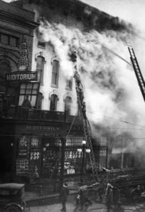 fire at Kresge's Fire damages the auditorium building, smoke billows from the top during an intense blaze in this historical black-and-white image.