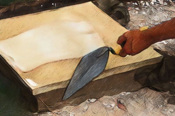 Mörtel abschneiden und Lücken füllen