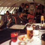 A group of people sitting at a table in a restaurant