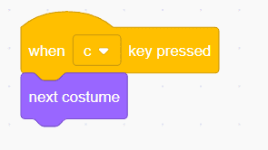 Scratch block — when C key pressed triggers next costume for interactive costume switching