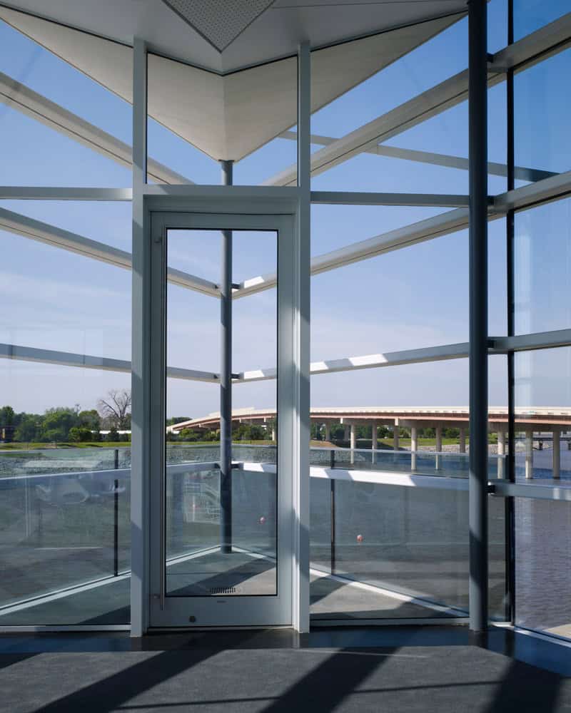 Interior glass structure of CHK Finish Line Tower highlighting OKC Boathouse District architecture and modern boathouse design by Rand Elliott Architects Oklahoma City.