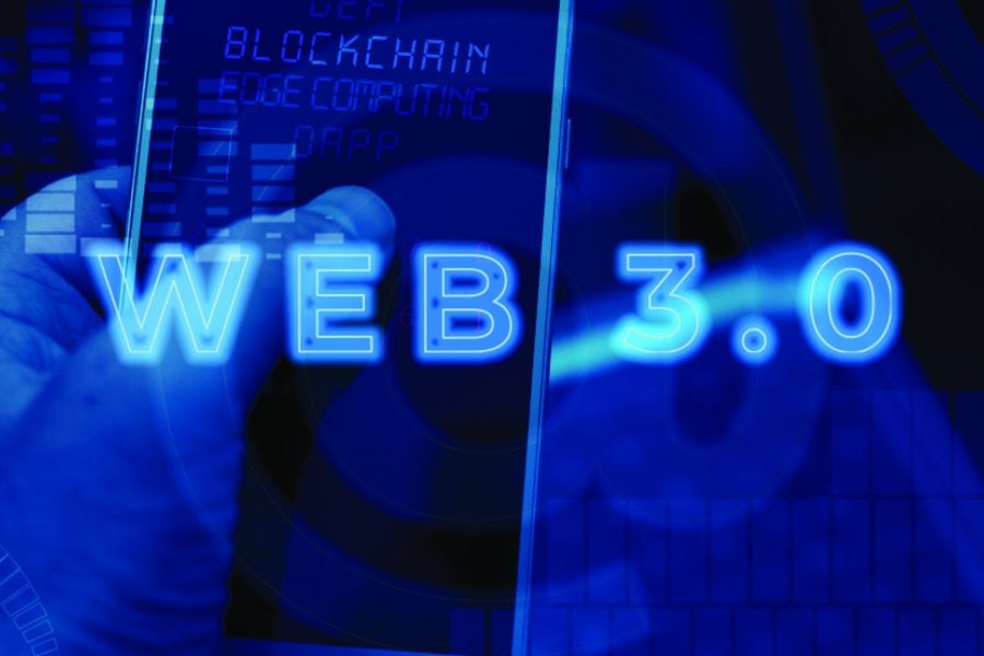 A futuristic graphic with the glowing text "WEB 3.0" prominently displayed in bright neon blue. In the background, a hand holds a smartphone showing text related to blockchain, edge computing, and decentralized applications (DApps). The overall design features digital elements and a tech-inspired theme, symbolizing advancements in internet technology and the decentralized web.