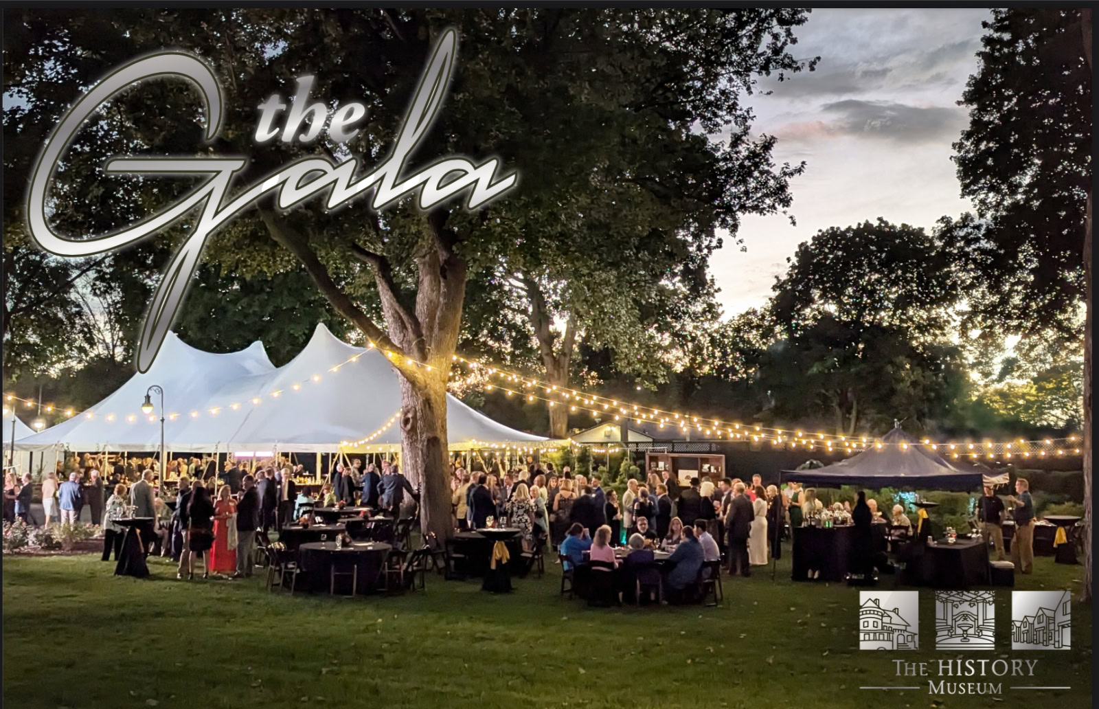 Cover invitation 2025 Landscape v4Current ke Elegant outdoor gala event at The History Museum under string lights with mingling guests, tents, and lush trees at dusk, showcasing community engagement and historic celebration.