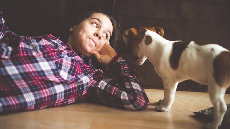 Woman with her small puppy