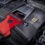 A bag of luggage sitting on top of a suitcase