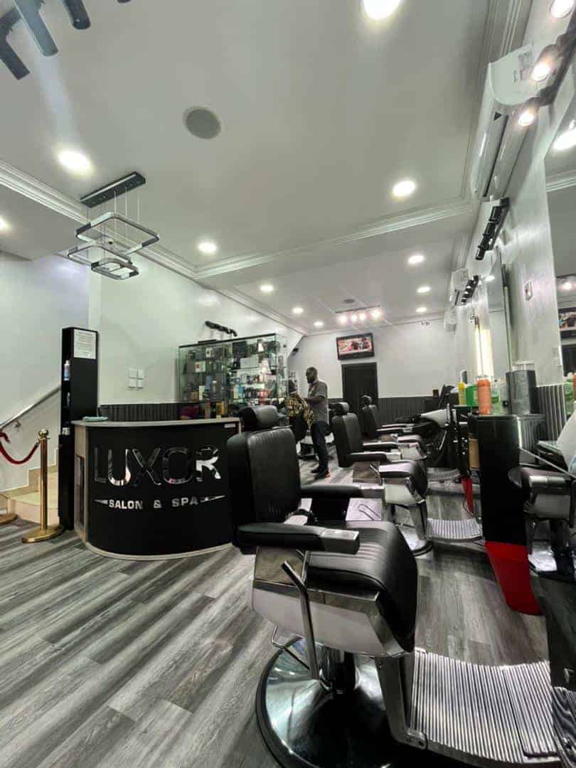 Modern hair salon interior with black styling chairs