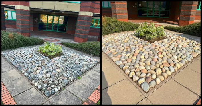 Jet washing patio with visible water runoff