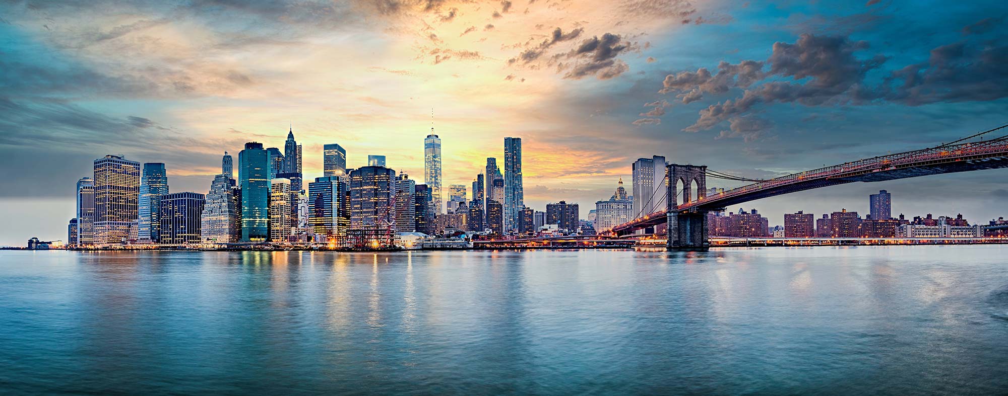 The Manhattan waterfront skyline at dawn.
