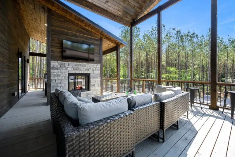 Broken bow luxury cabin patio with cozy seating and forest views.
