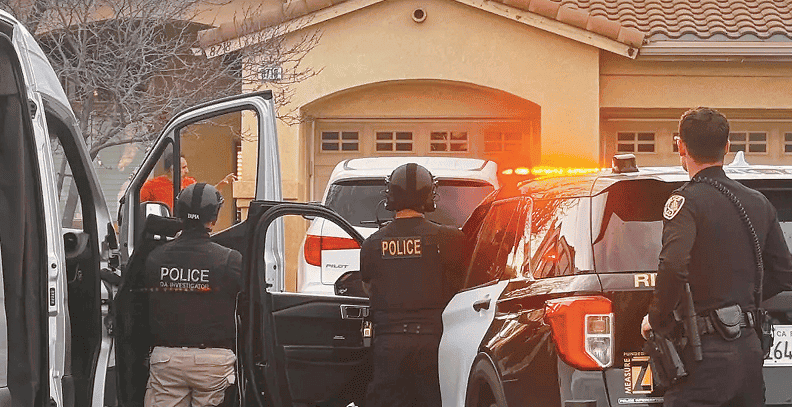 Riverside County Sheriff’s deputies search a residential area during an operation related to a child sexual abuse material investigation.