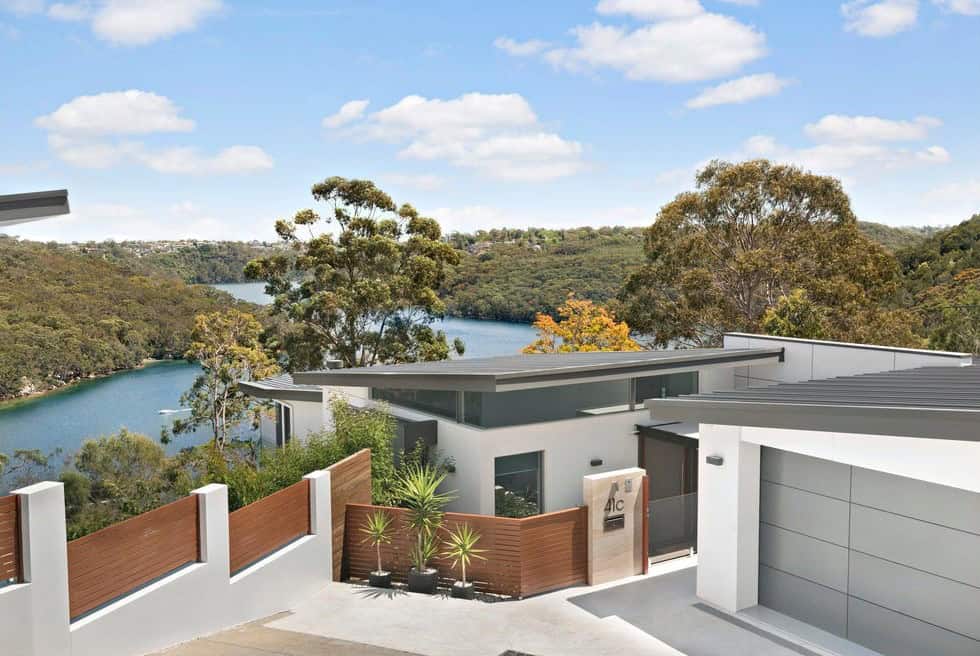 Herbert Nagel Designed modern home on a sloping harbourside site with water views in the background.