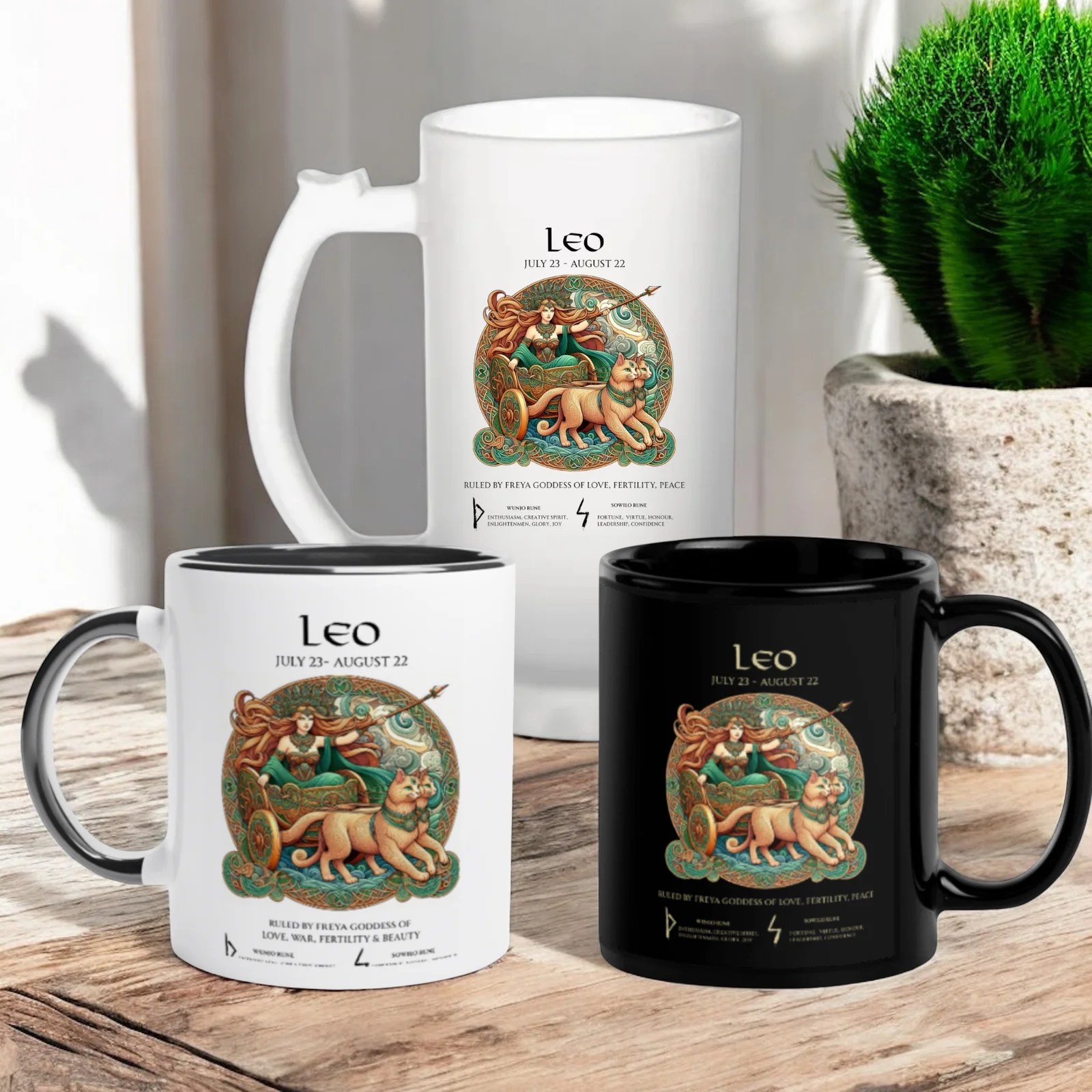 Leo Season 6 Three mugs—one tall white, one standard white, and one black—displaying an illustration of a goddess riding a chariot pulled by lions. The mugs also feature the Leo zodiac sign and its date range.