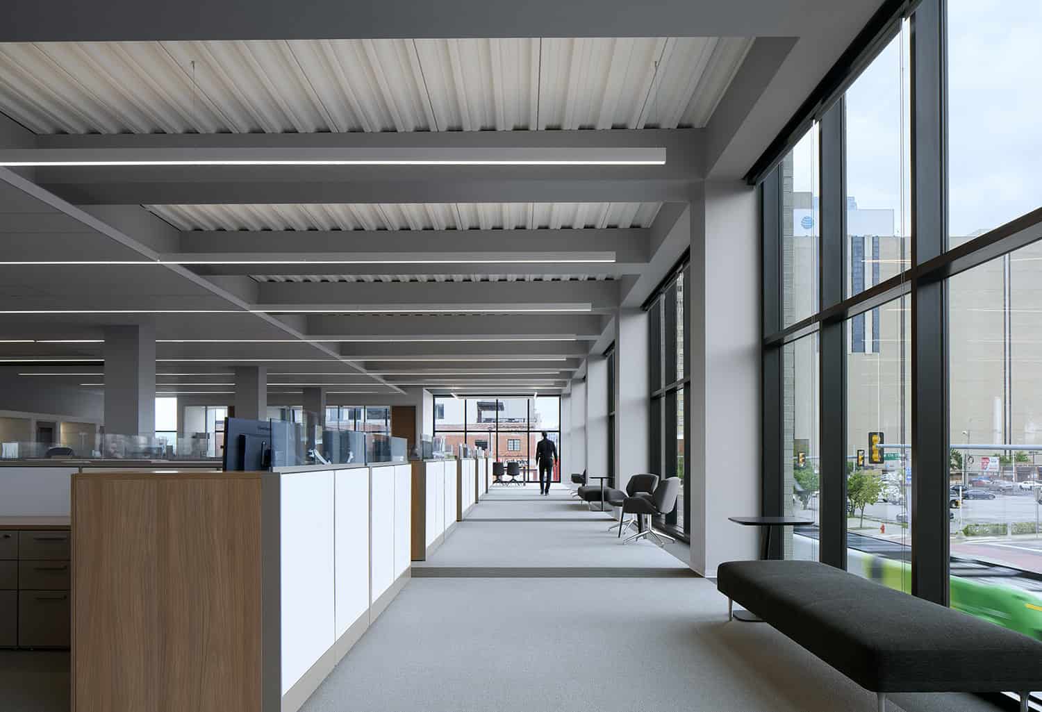 Interior office space at Heartland Headquarters in Oklahoma City, featuring modern workstations, large windows, and natural light."