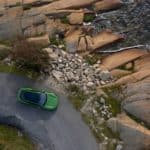A close up of a stone building that has a rocky cliff