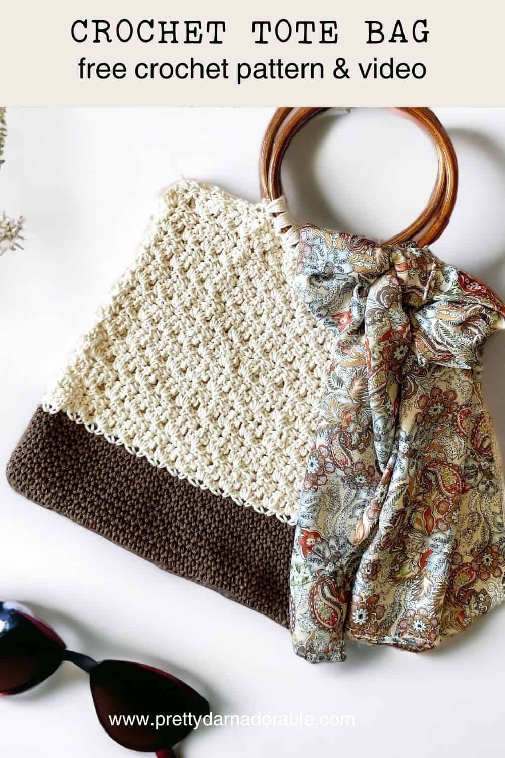 Cream crochet tote bag with brown bottom and round wooden handles