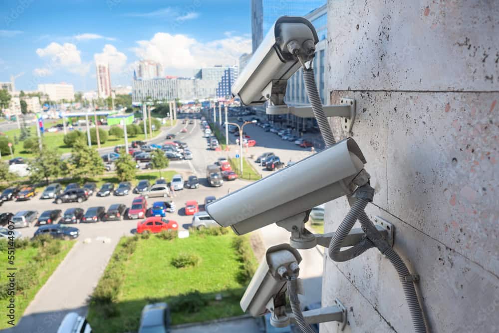 Video surveillance cameras on wall looking at street area
