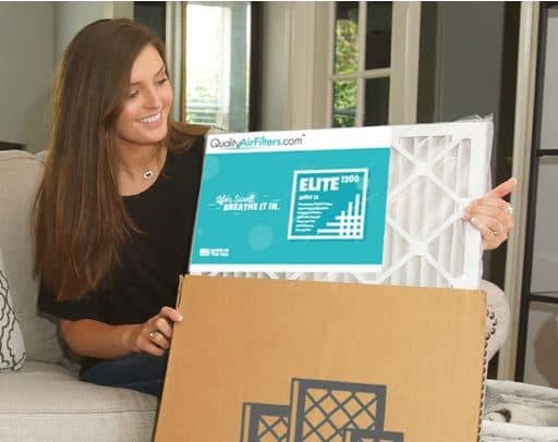 Woman Holding a Quality Air Filter Box
