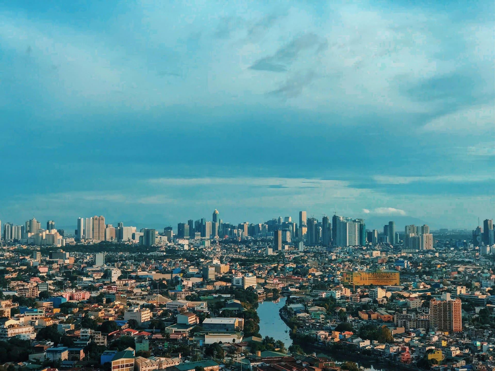 Aerial view of the Manila skyline showing a modern connected urban business district in the Philippines