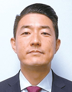 Paul Seo Assembly run candid headshot