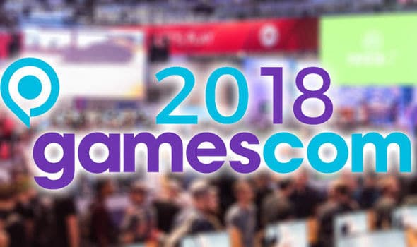 Gamescom-2018-1006218 Visiteurs participant à une conférence de jeux vidéo lors de la Gamescom 2018, avec stands et écrans lumineux, mettant en valeur la passion pour le gaming et l'industrie du divertissement interactif.