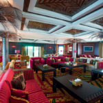 A group of people sitting at a table in a room