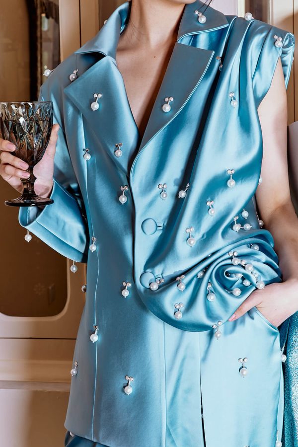 blue suit with pearls