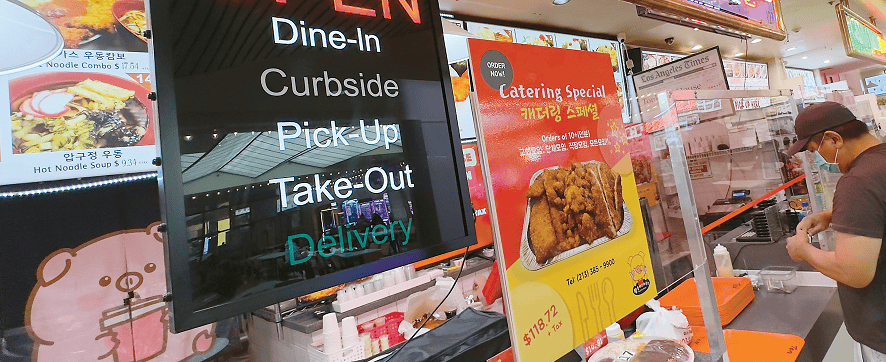 Uber Eats payment issues sign at LA restaurant pickup counter