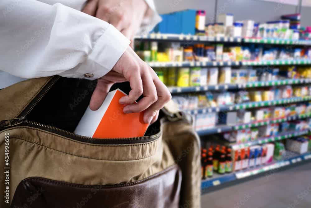 Retail Shoplifting. Woman Stealing In Supermarket. Theft