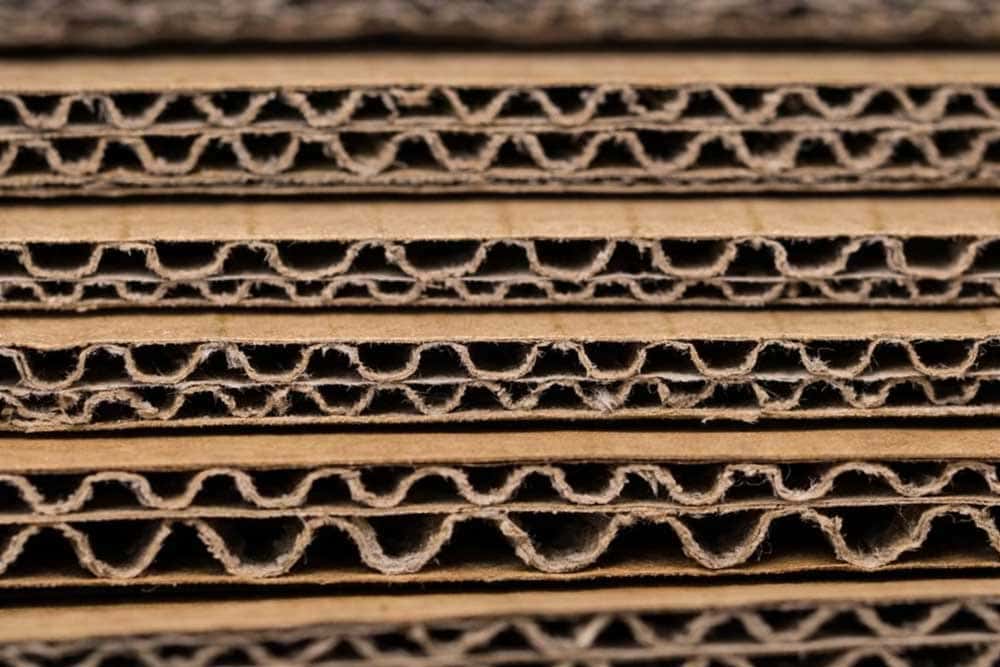 Cardboard boxes in Glasgow showing close-up layers of single and double flute corrugated board, highlighting durable packaging materials for storage, shipping, and moving supplies.