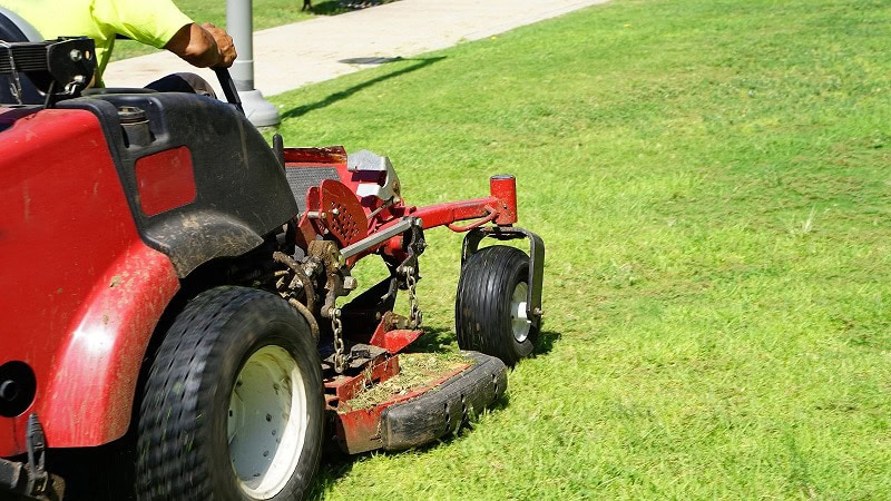 Man using a Zero Turn Lawn Mower