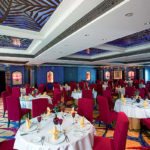 A group of people sitting at a table in a restaurant