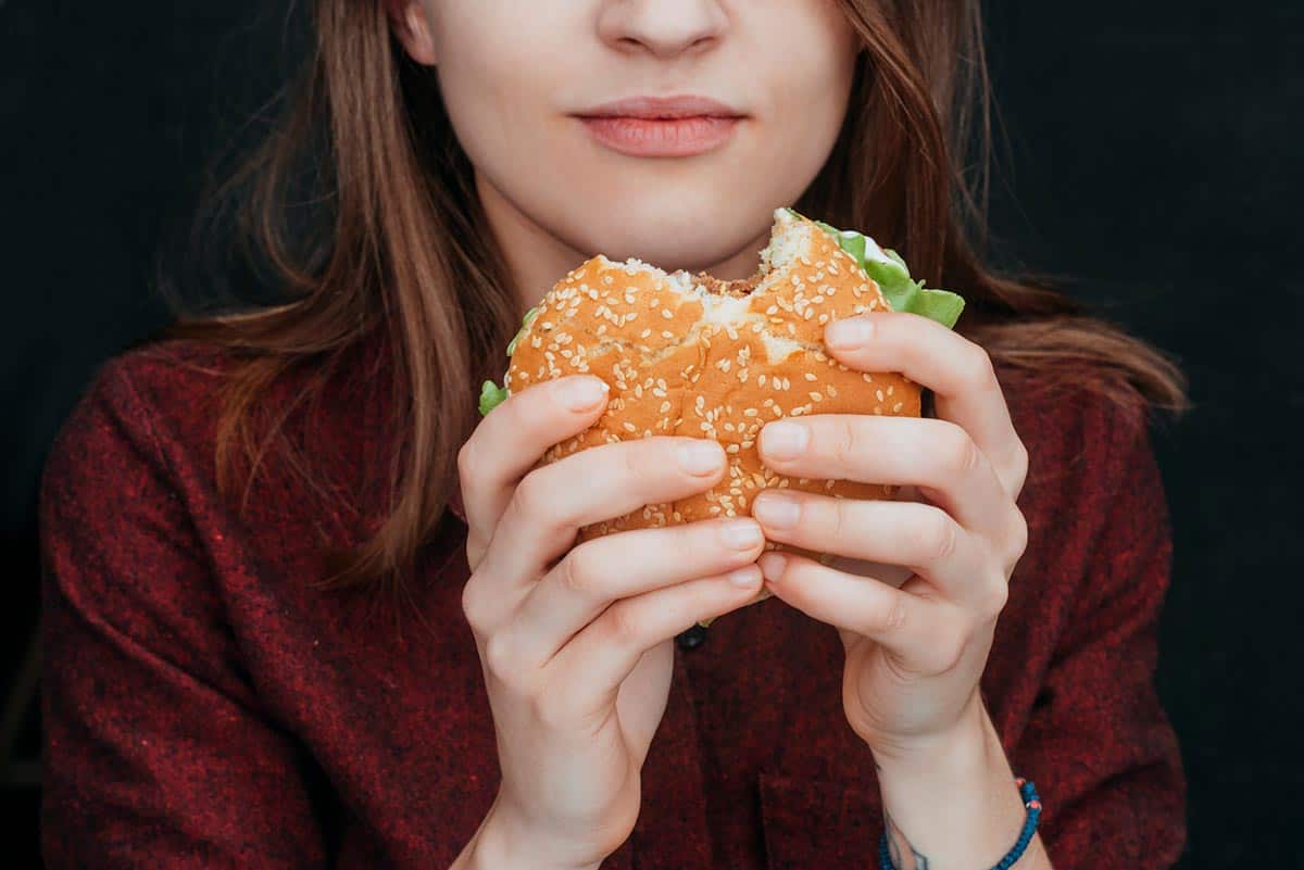 Woman eating burger