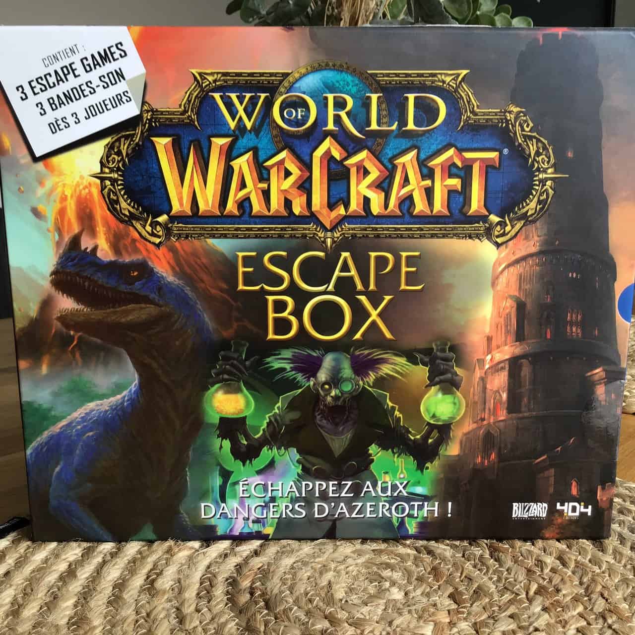Fichier, World of Warcraft Escape Box jeu de société pour fans, contenu et aventure, illustration de mage, dinosaure et château, jeu stratégique, événement geek, jeu à thème fantastique, idée cadeau gamer, aventure Azeroth, divertissement pour joueurs, énigmes et défis, esprit d'équipe, jeu immersif, accessoire de jeu, symboles fantastiques.