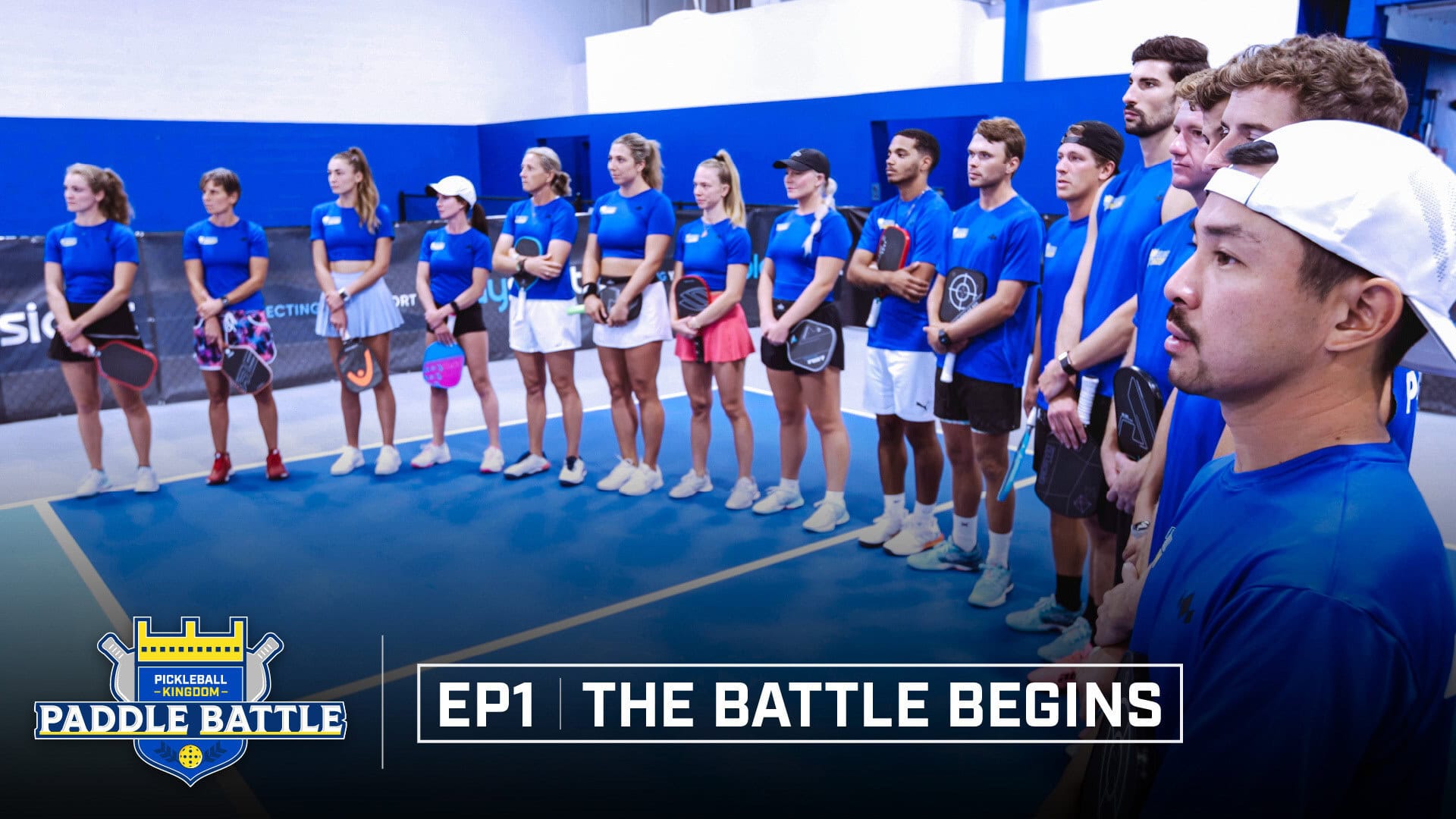 Paddle Battle contestants line up on an indoor court for Episode 1 introductions