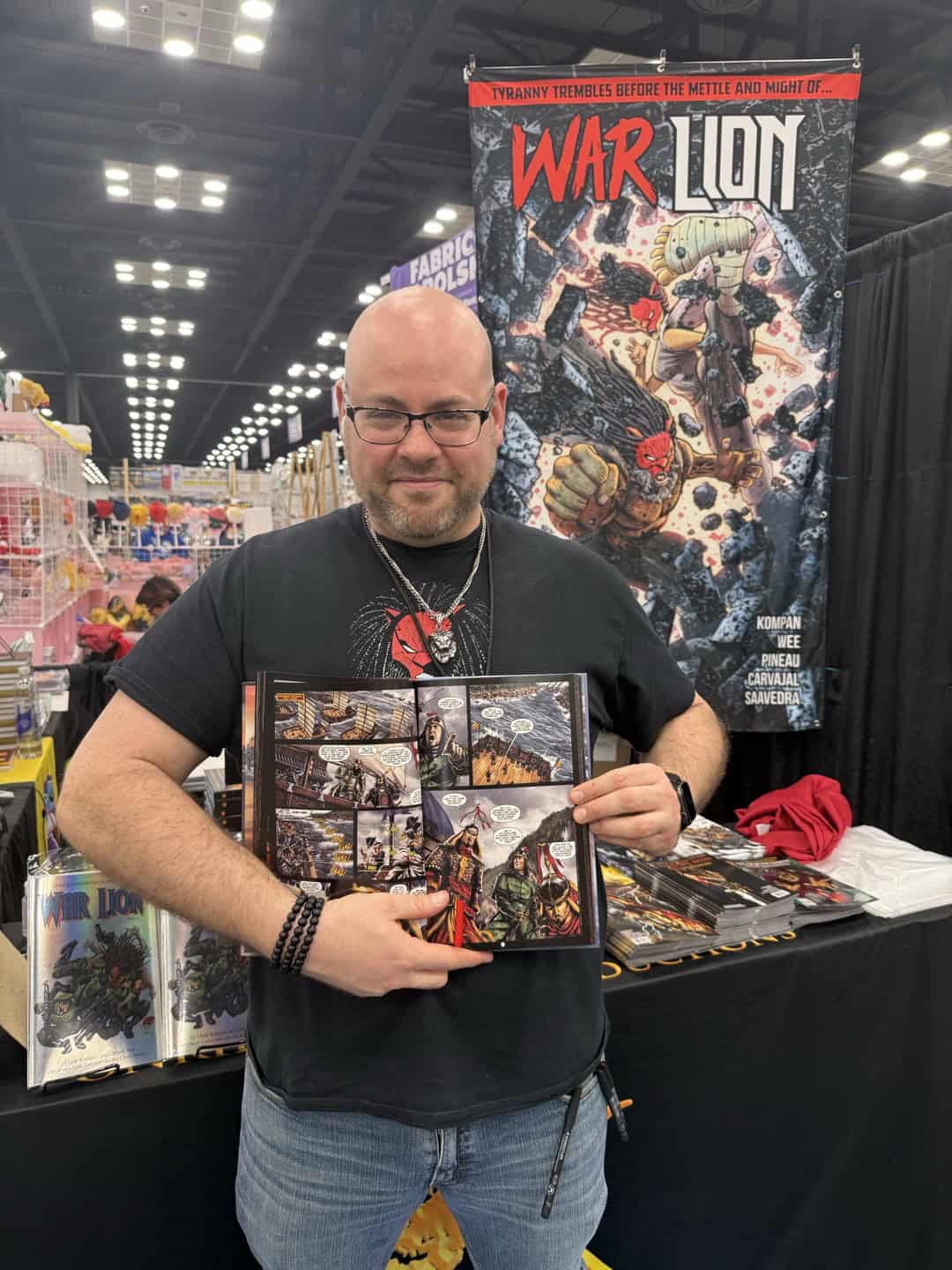 Illinois-based comic artist Onrie Kompan holds his Yi Soon Shin comic series, which has sold over 250,000 copies worldwide.