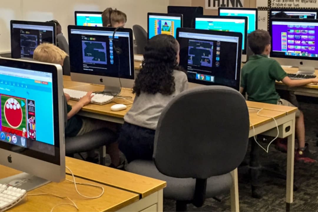 A large Coding Class  with may kids doing coding
