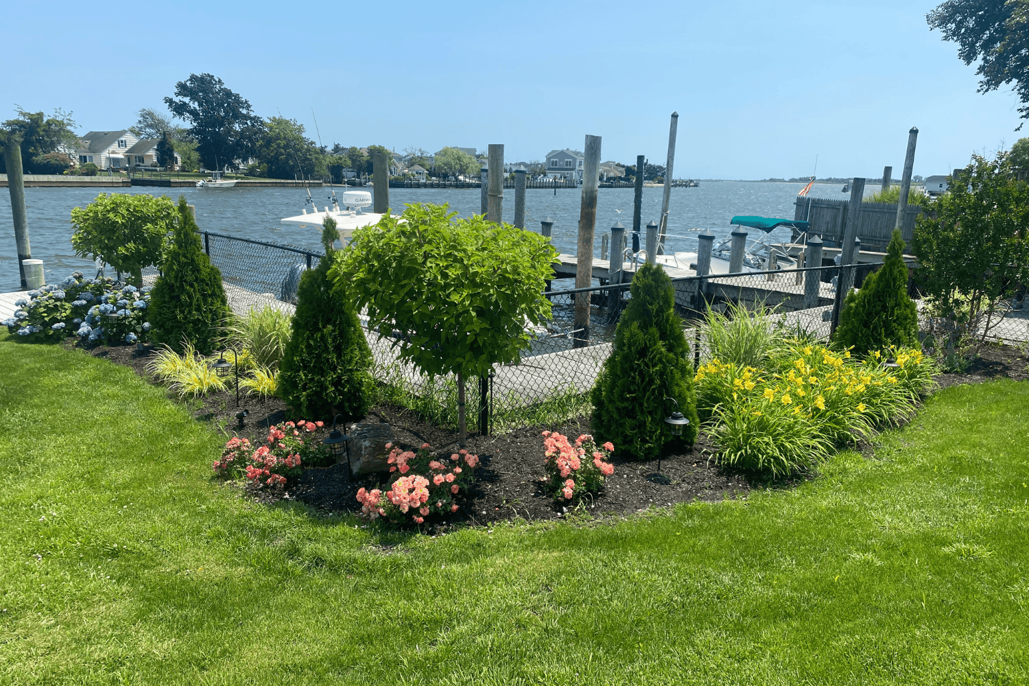 Lush garden by tranquil waterway